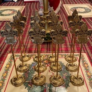 Set of twelve ornate gold fleur de lis place card holders